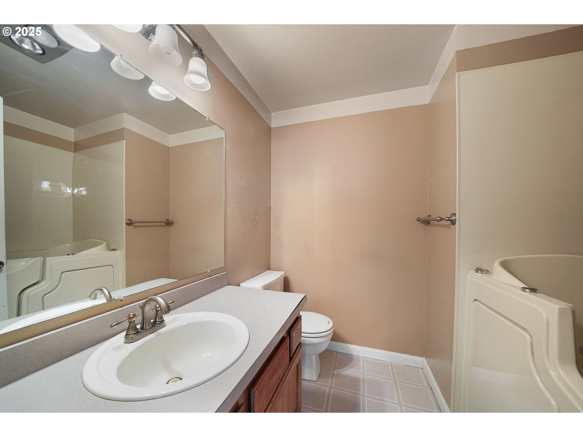 550 Evergreen Loop Reedsport, OR 97467 - Photo 24 of 35 a bathroom with a sink and a mirror