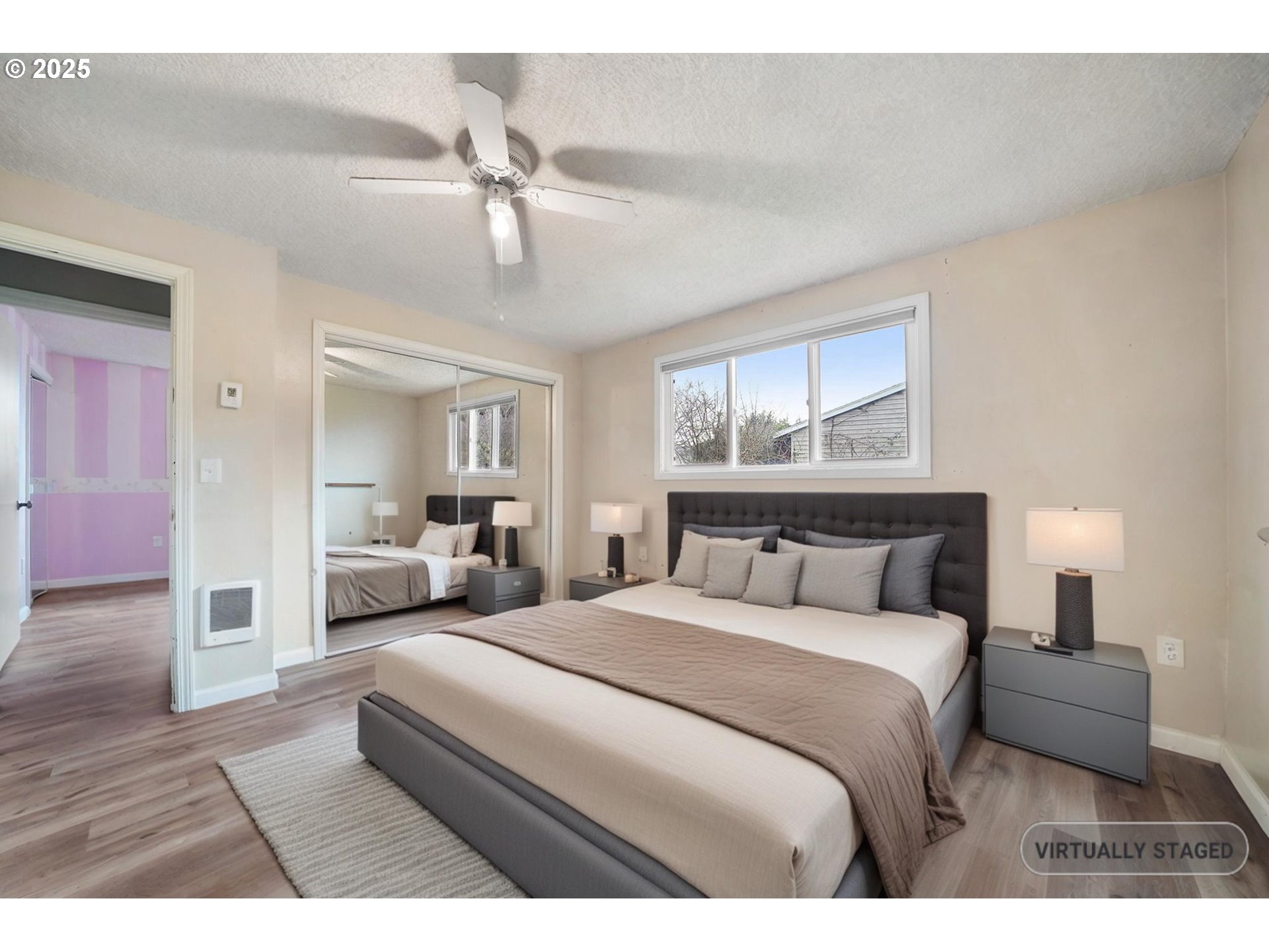 550 Evergreen Loop Reedsport, OR 97467 - Photo 26 of 35 a bedroom with a large bed and a chandelier