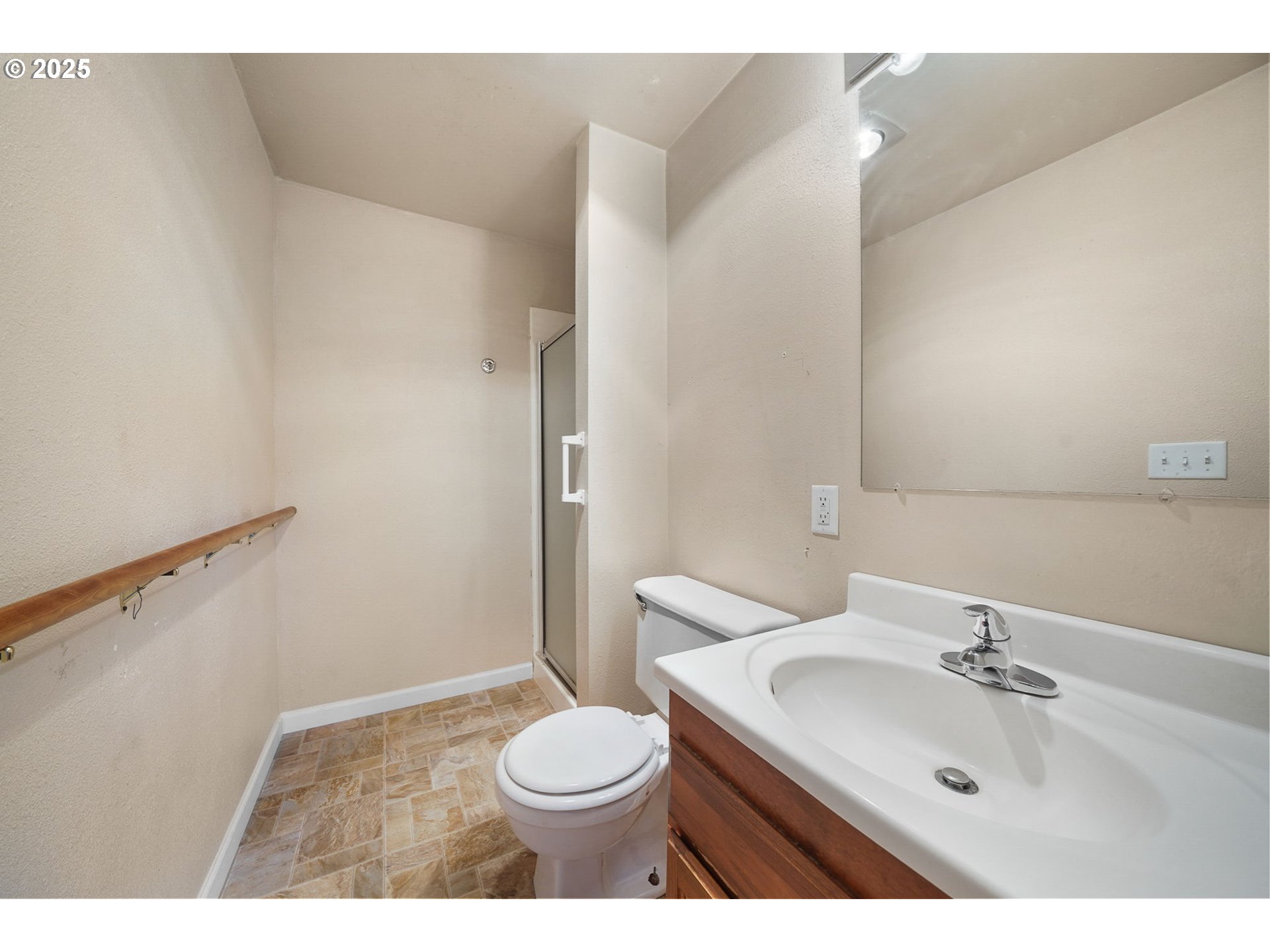 550 Evergreen Loop Reedsport, OR 97467 - Photo 28 of 35 a bathroom with a sink a toilet and a mirror