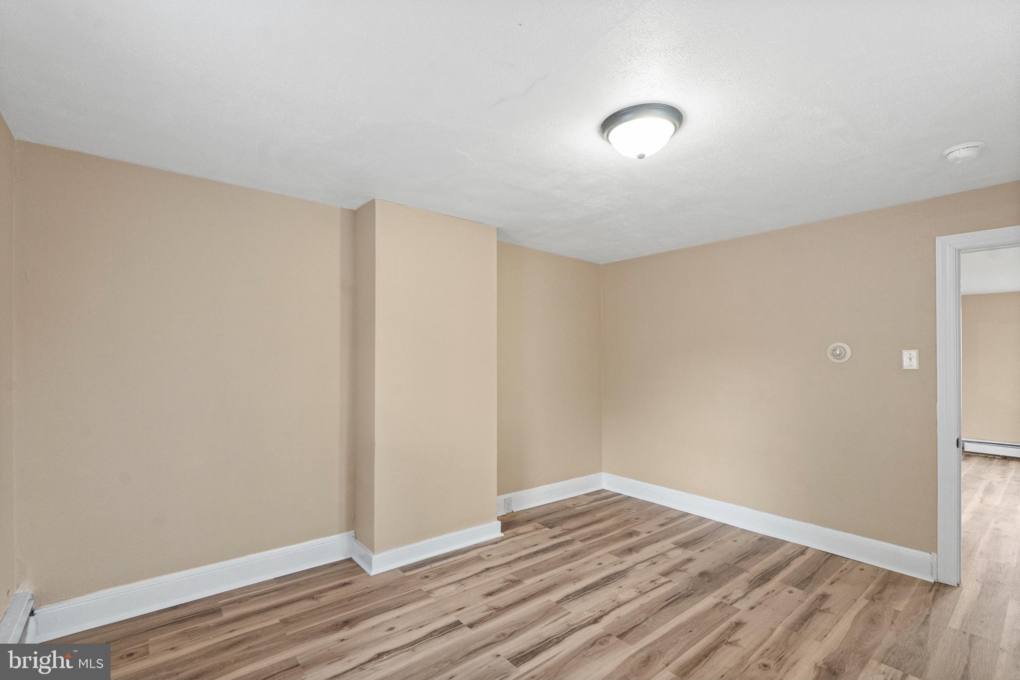 50 Pine Street Beverly, NJ 08010 - Photo 11 of 18 a view of an empty room with wooden floor