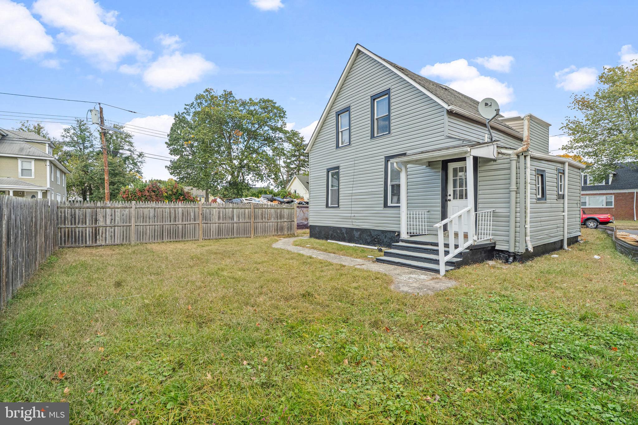 50 Pine Street Beverly, NJ 08010 - Photo 16 of 18 a view of a house with backyard and a tree