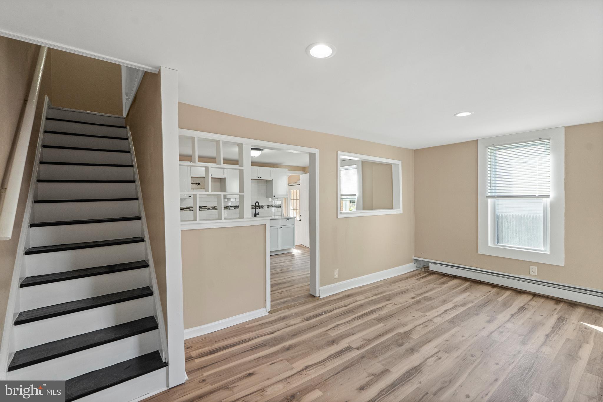 50 Pine Street Beverly, NJ 08010 - Photo 7 of 18 wooden floor in an empty room with a window