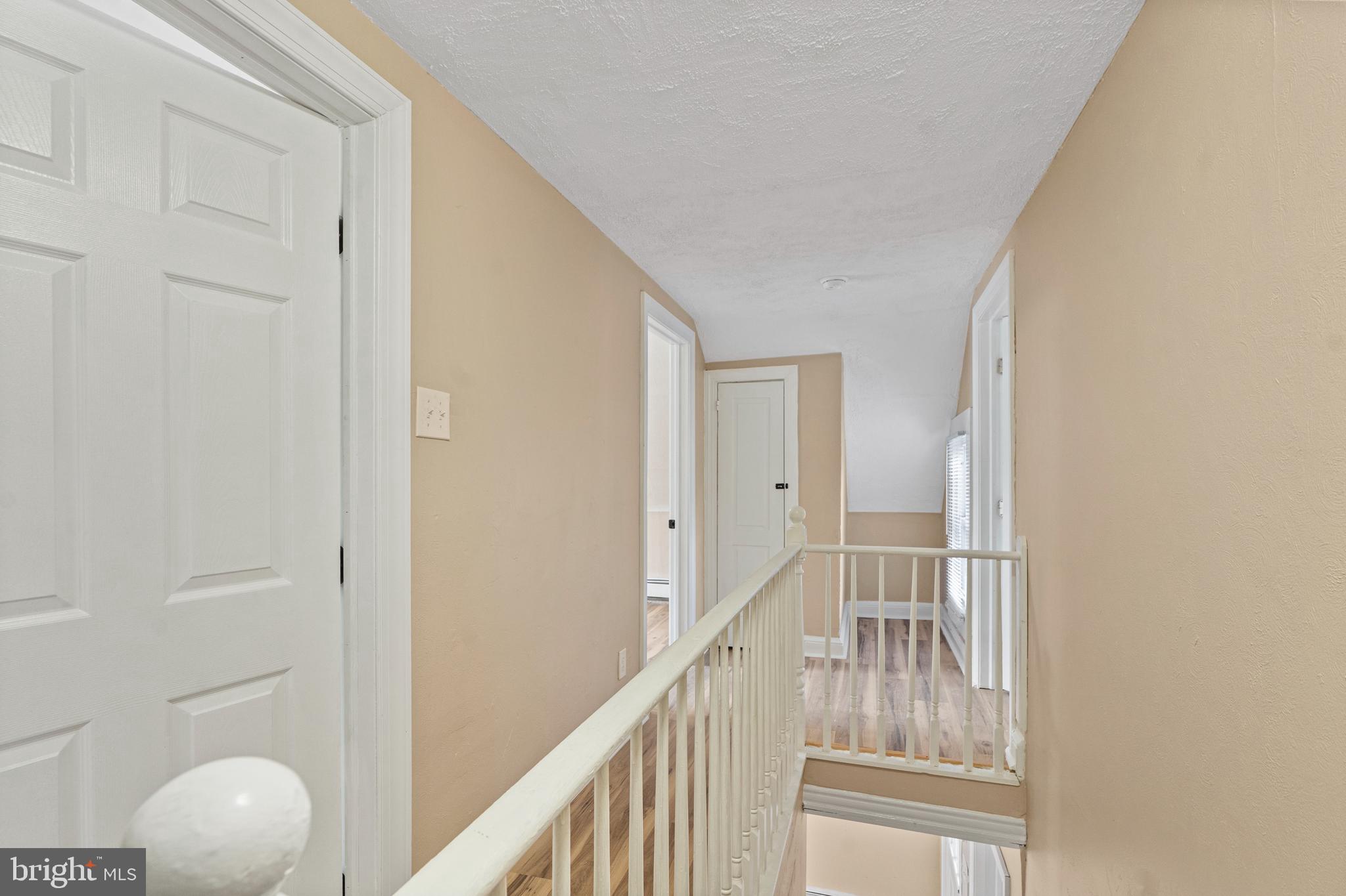 50 Pine Street Beverly, NJ 08010 - Photo 9 of 18 a view of a hallway with wooden floor and entryway
