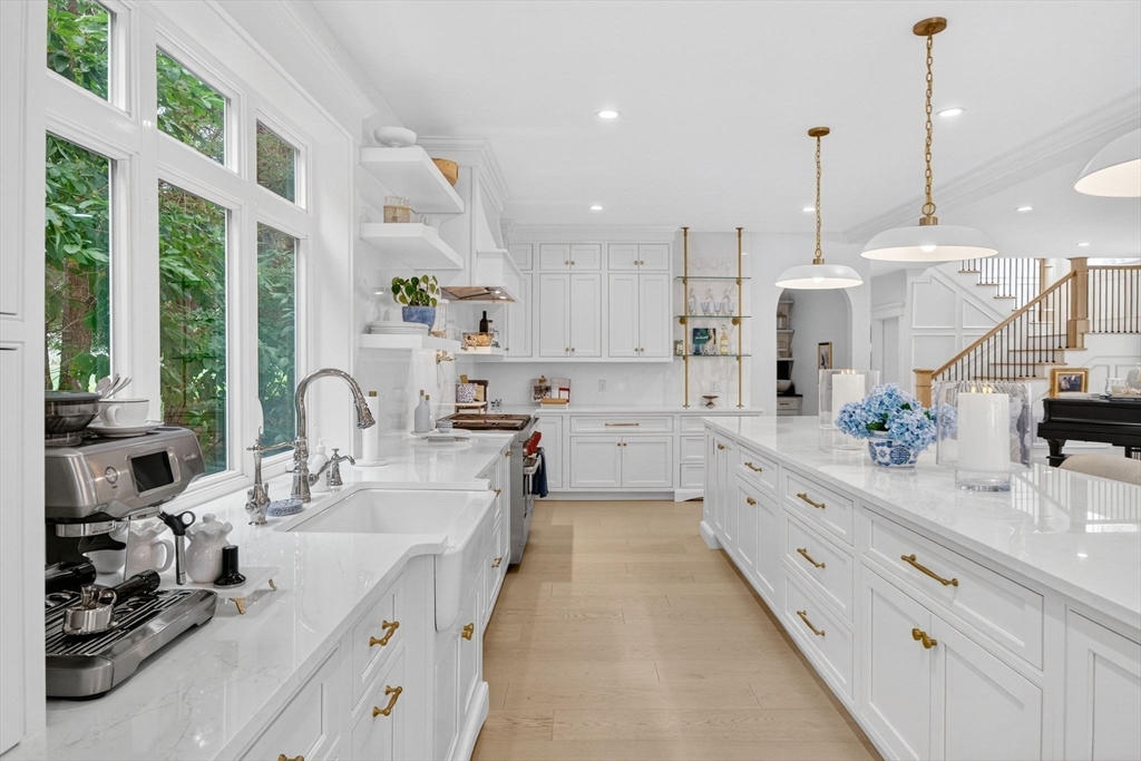 738 Smith Neck Road Dartmouth, MA 02748 - Photo 11 of 42 a large kitchen with kitchen island lots of counter space a sink and a large window
