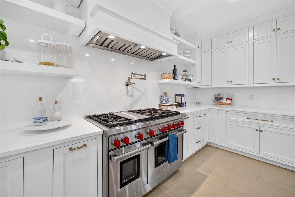 738 Smith Neck Road Dartmouth, MA 02748 - Photo 12 of 42 a kitchen with cabinets appliances and a sink