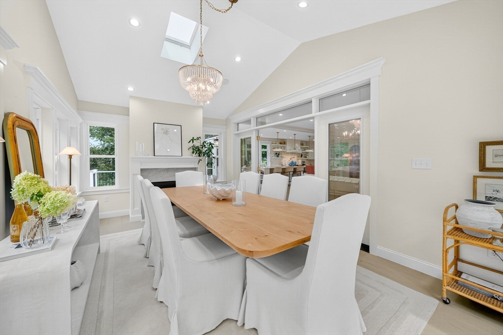 738 Smith Neck Road Dartmouth, MA 02748 - Photo 14 of 42 a view of a dining room with furniture and a chandelier