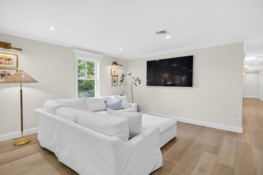 738 Smith Neck Road Dartmouth, MA 02748 - Photo 31 of 42 a living room with furniture and a flat screen tv