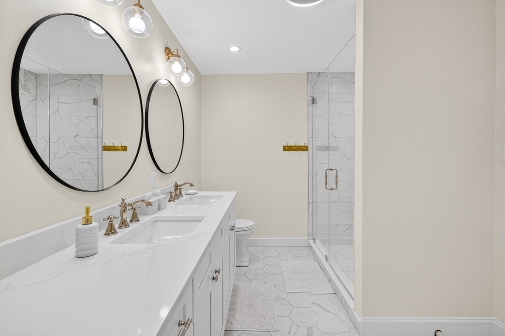 738 Smith Neck Road Dartmouth, MA 02748 - Photo 34 of 42 a bathroom with a sink and a mirror