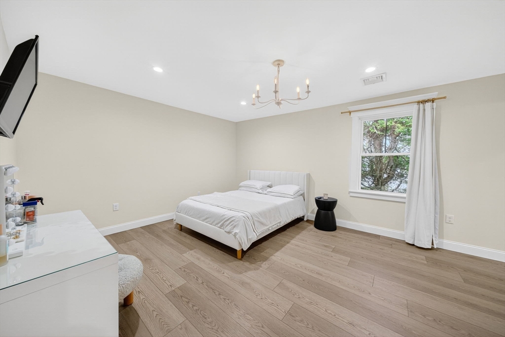 738 Smith Neck Road Dartmouth, MA 02748 - Photo 35 of 42 a bedroom with a bed and a window