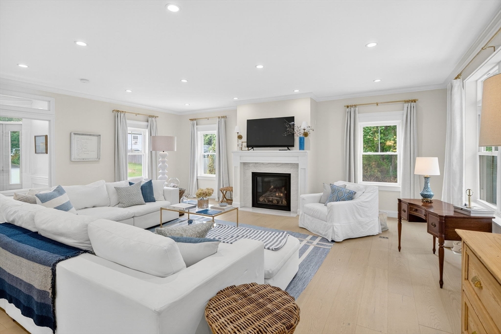 738 Smith Neck Road Dartmouth, MA 02748 - Photo 4 of 42 a living room with furniture fireplace and window