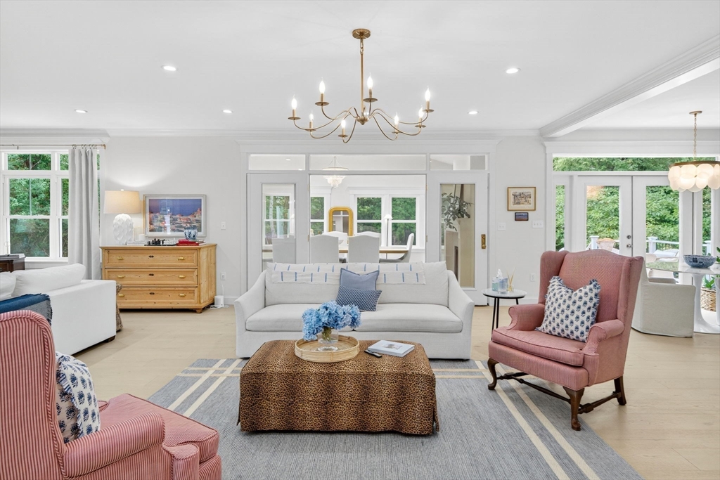 738 Smith Neck Road Dartmouth, MA 02748 - Photo 6 of 42 a living room with furniture and a chandelier