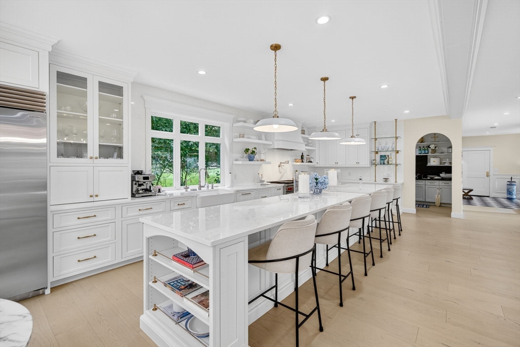 738 Smith Neck Road Dartmouth, MA 02748 - Photo 10 of 42 a kitchen with kitchen island a large counter top space appliances and cabinets