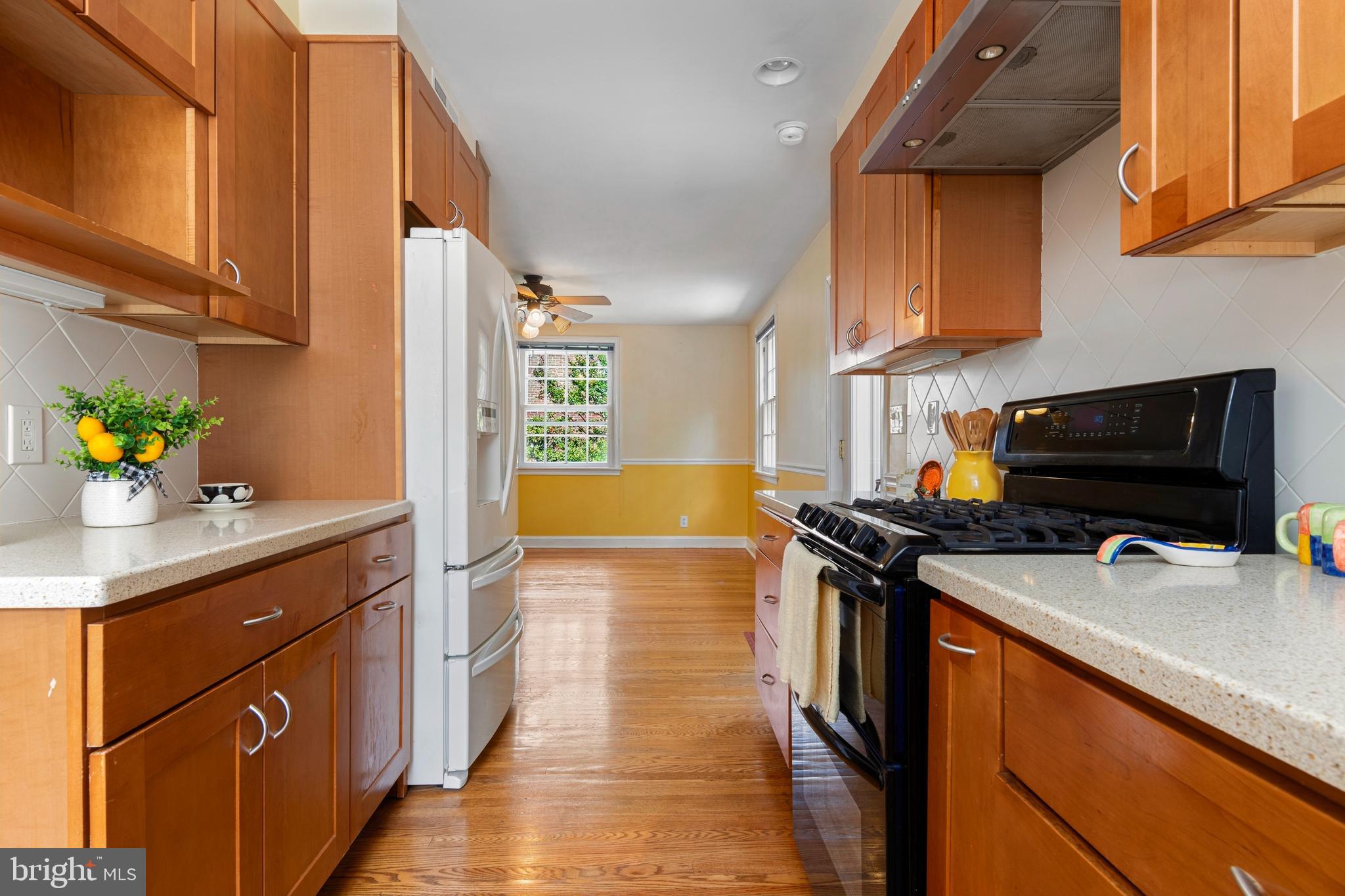 5020 Dermond Road Drexel Hill, PA 19026 - Photo 18 of 39 a kitchen with stainless steel appliances a stove a sink dishwasher and cabinets with wooden floor