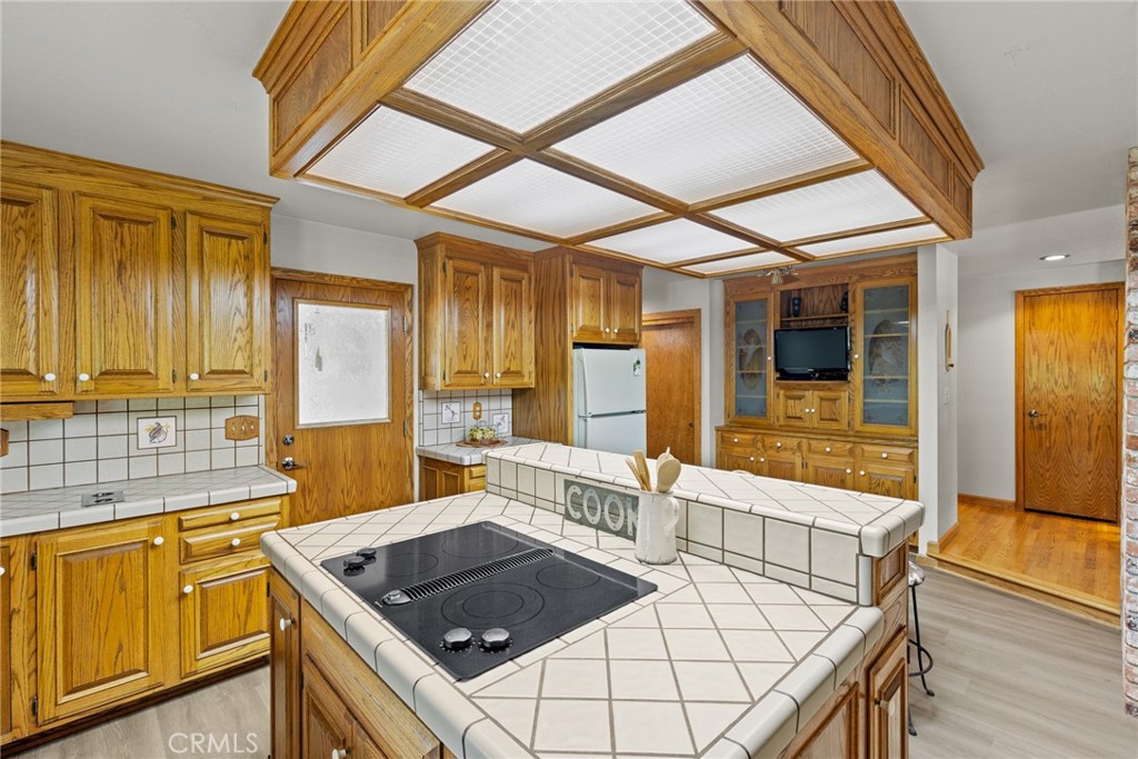 3582 Keefer Road Chico, CA 95973 - Photo 16 of 75 a kitchen with stainless steel appliances granite countertop a sink and a wooden cabinets