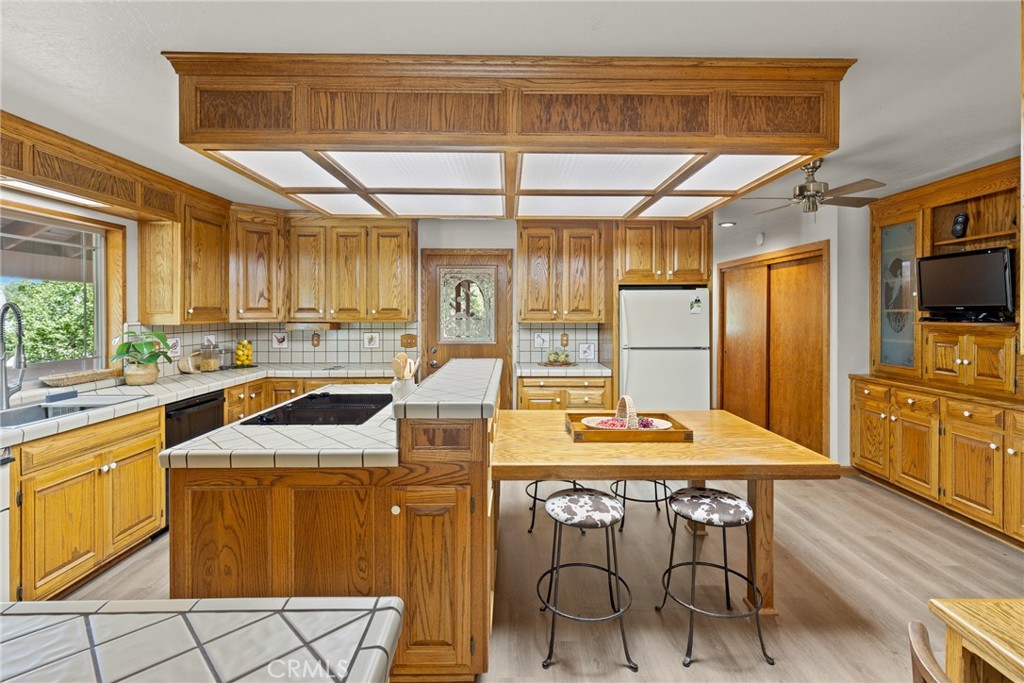 3582 Keefer Road Chico, CA 95973 - Photo 17 of 75 a kitchen with stainless steel appliances granite countertop a sink and a refrigerator