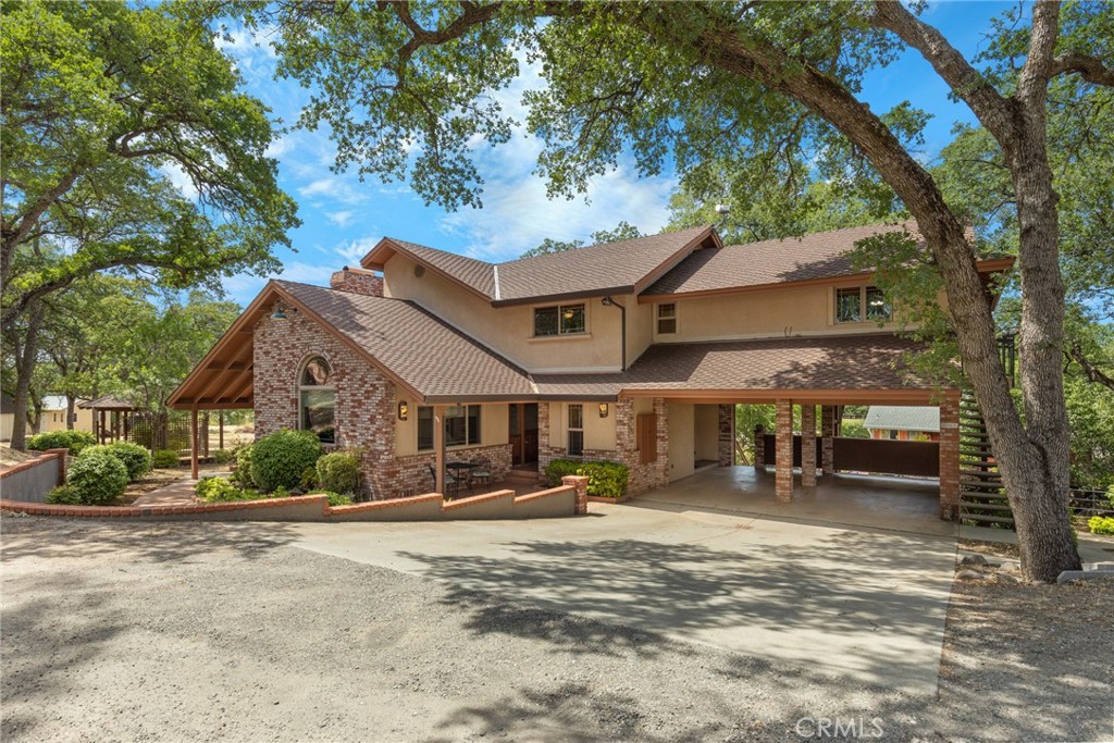 3582 Keefer Road Chico, CA 95973 - Photo 2 of 75 a front view of a building with a yard and large trees