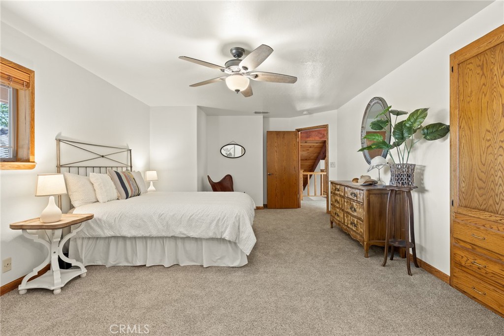 3582 Keefer Road Chico, CA 95973 - Photo 21 of 75 a bedroom with a bed and a chandelier