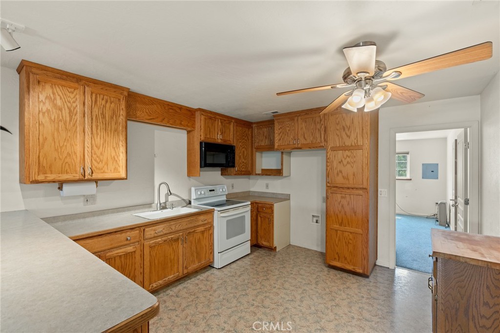 3582 Keefer Road Chico, CA 95973 - Photo 52 of 75 a kitchen with a sink appliances and cabinets