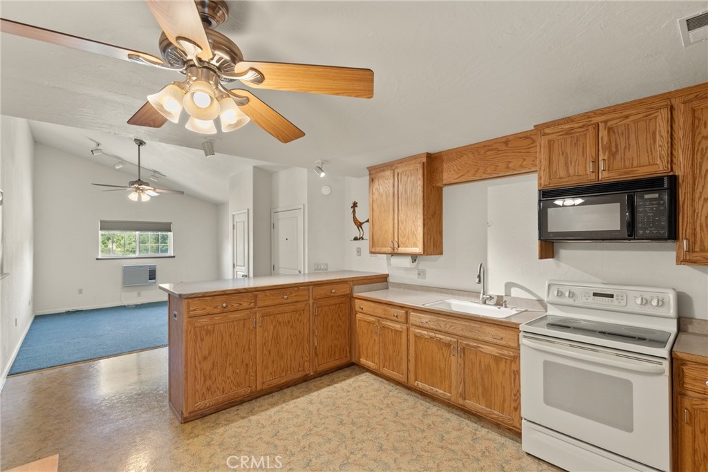 3582 Keefer Road Chico, CA 95973 - Photo 53 of 75 a view of a kitchen sink microwave and stove top oven