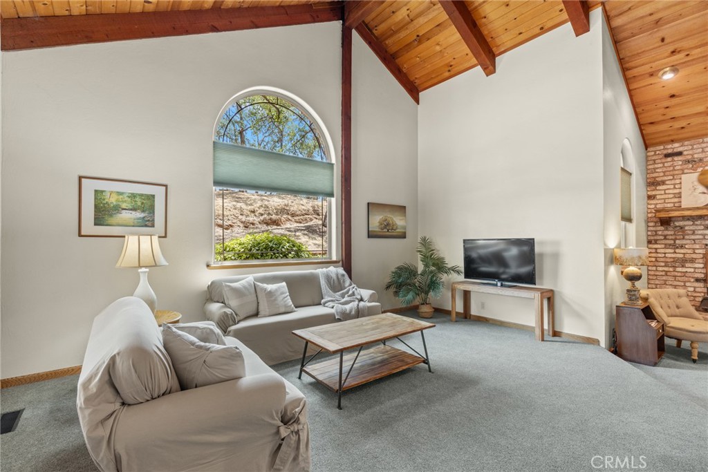 3582 Keefer Road Chico, CA 95973 - Photo 7 of 75 a living room with furniture a fireplace and a flat screen tv