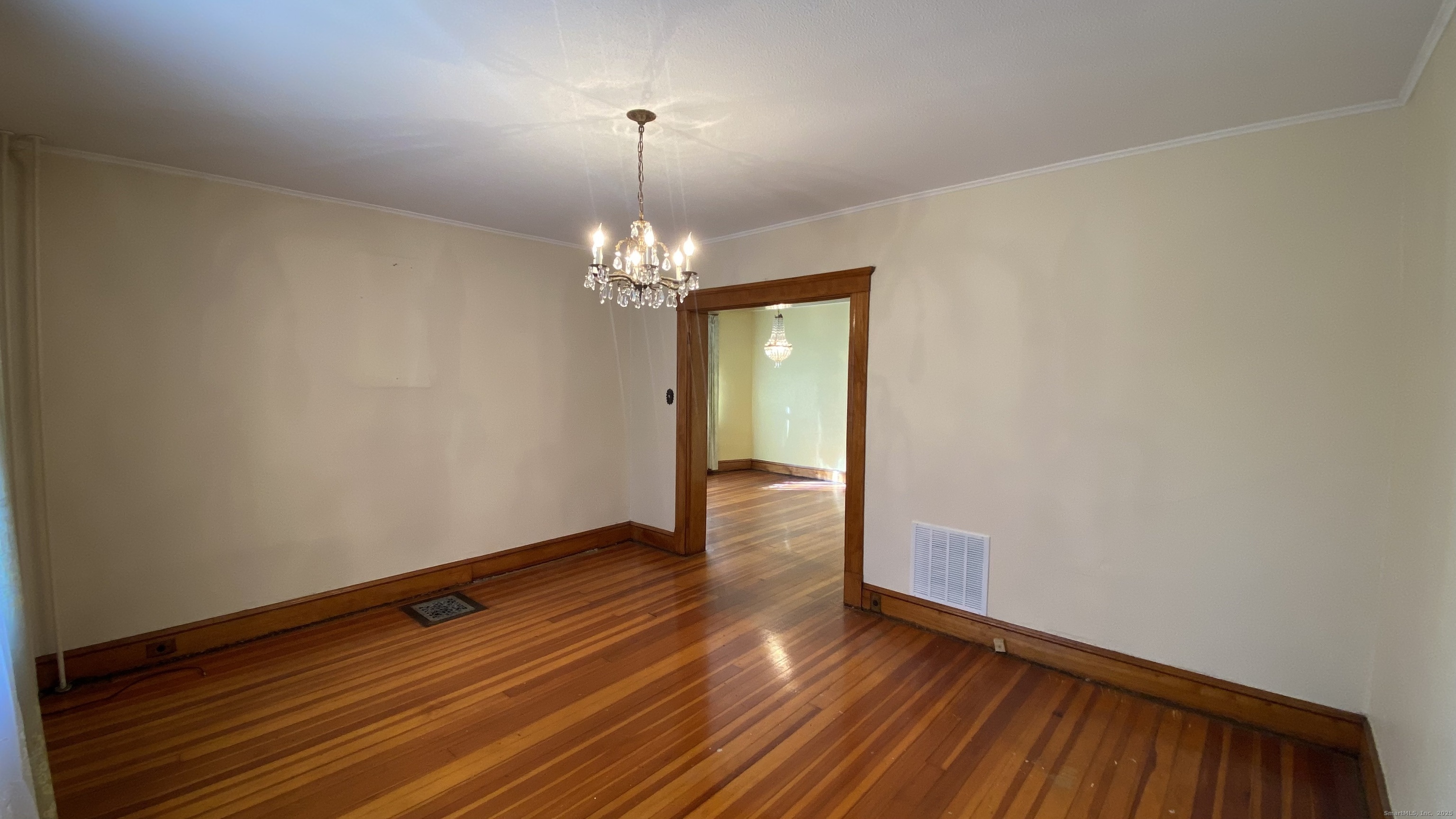 135 Elm Street, Unit 1 Winsted, CT 06098 - Photo 14 of 32 a view of room with wooden floor