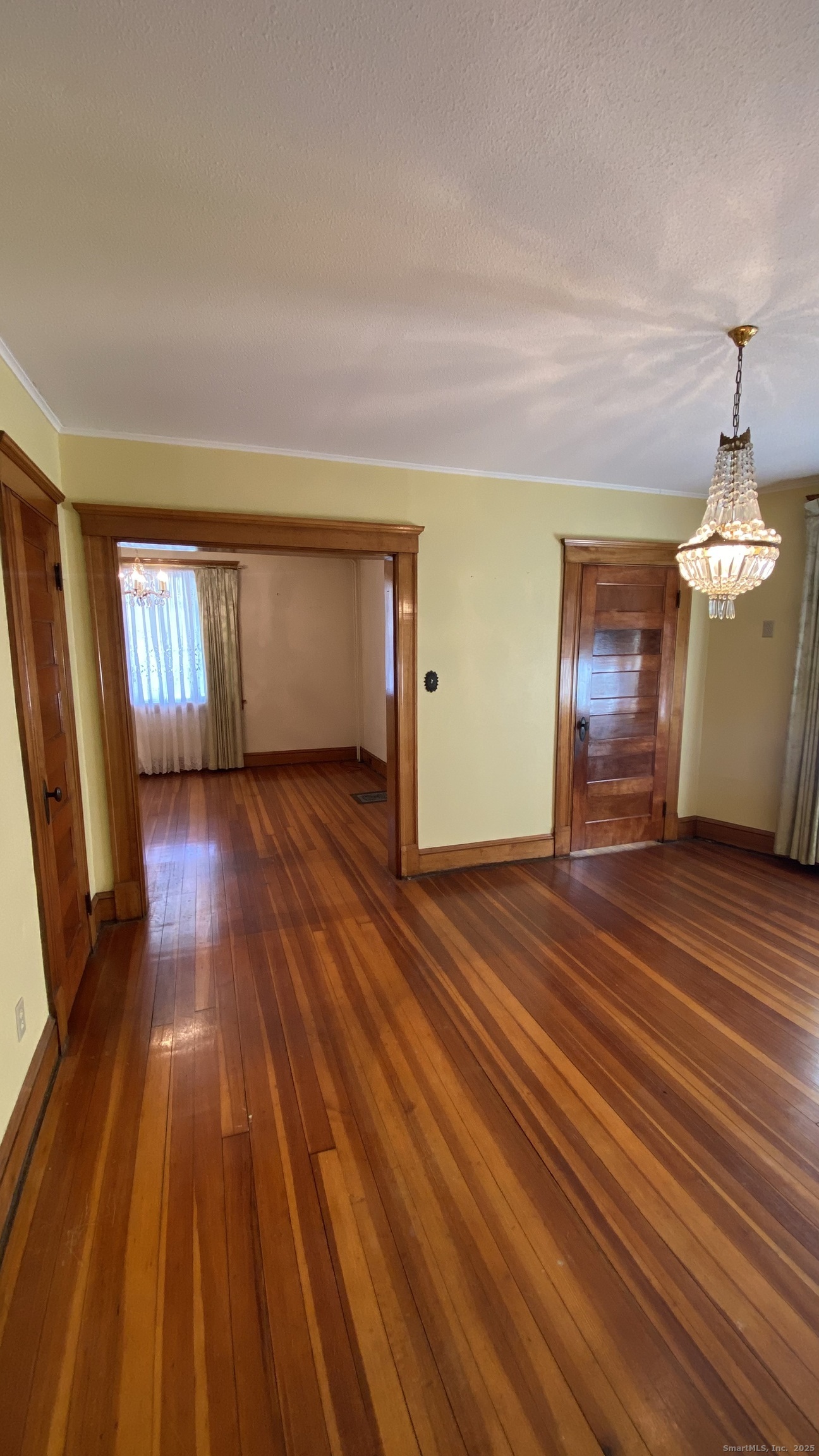 135 Elm Street, Unit 1 Winsted, CT 06098 - Photo 17 of 32 a view of a room with wooden floor staircase and a living room