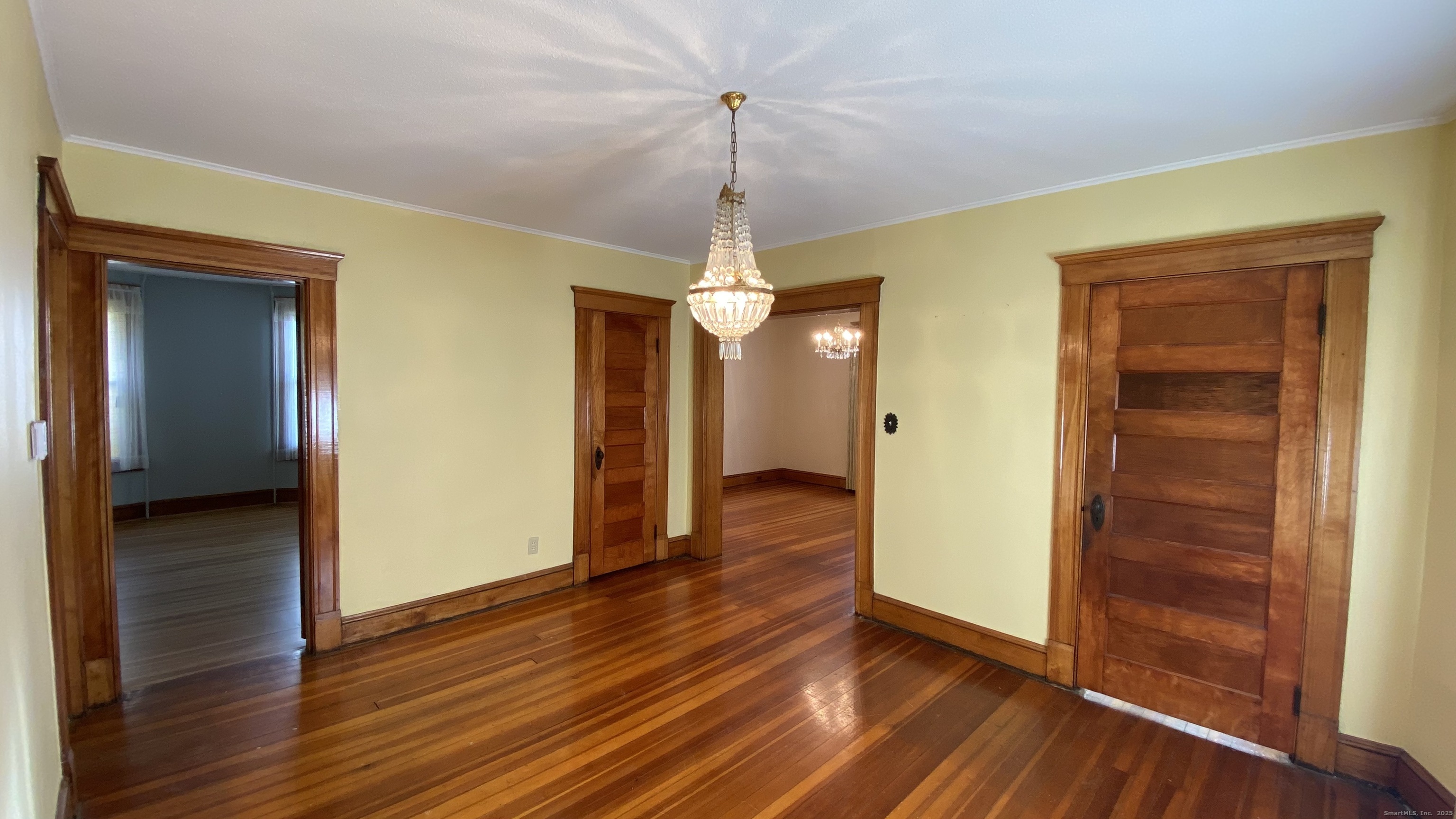 135 Elm Street, Unit 1 Winsted, CT 06098 - Photo 18 of 32 a view of a hallway with wooden floor