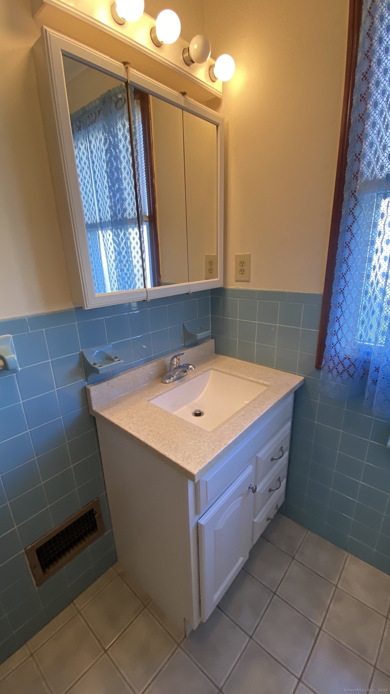 135 Elm Street, Unit 1 Winsted, CT 06098 - Photo 26 of 32 a bathroom with a tub sink and mirror