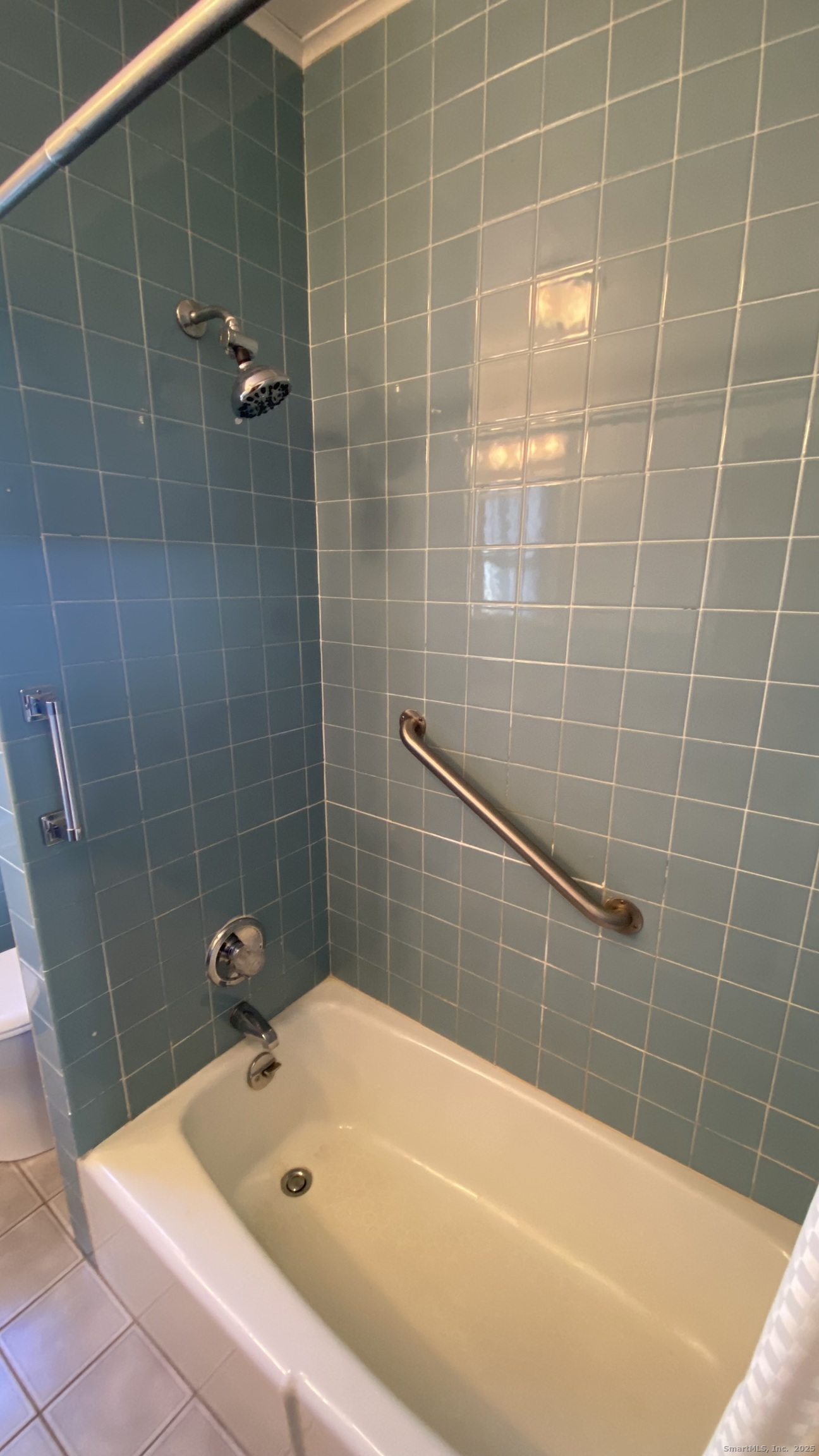 135 Elm Street, Unit 1 Winsted, CT 06098 - Photo 28 of 32 a bathroom with a bath tub