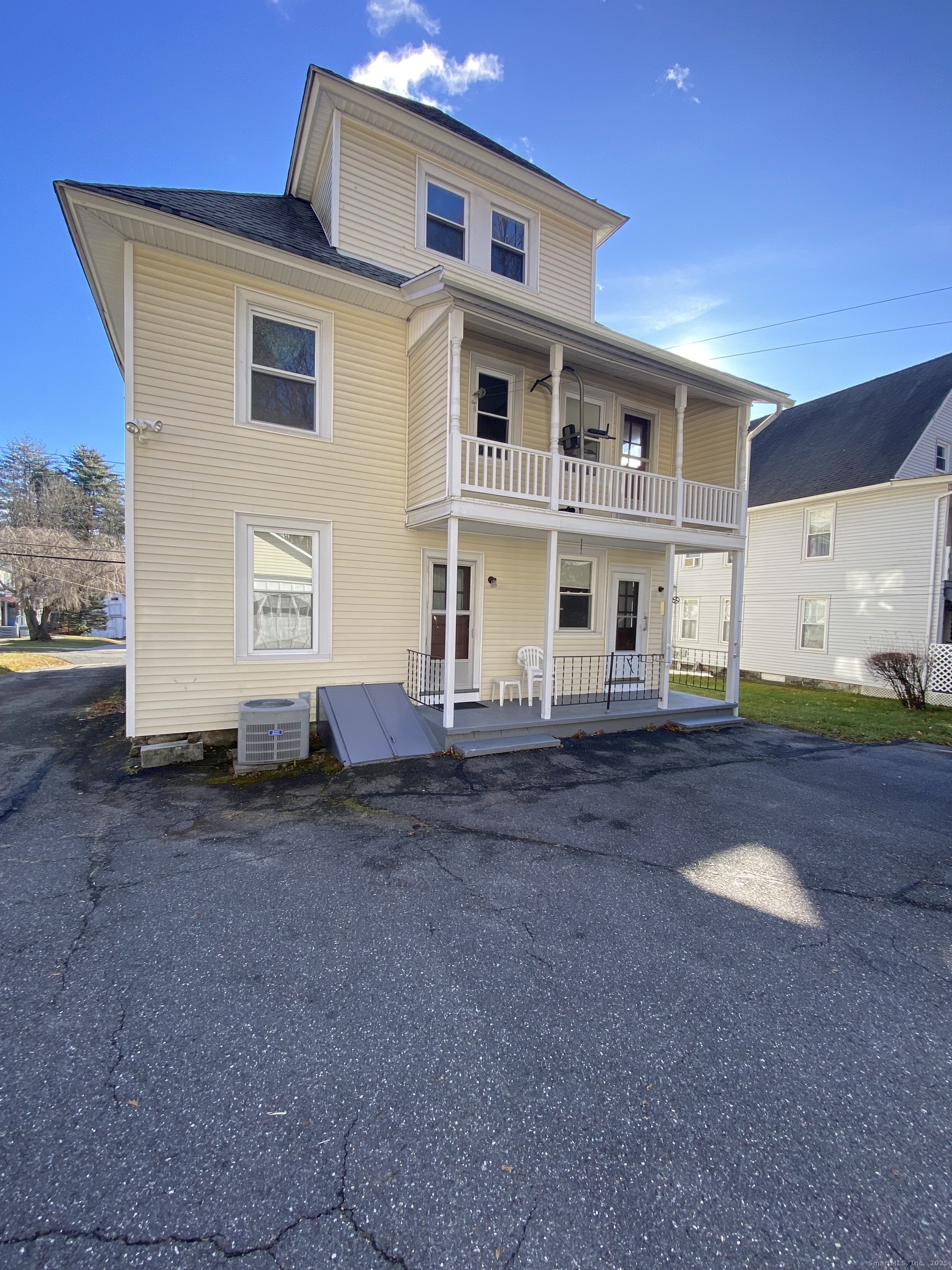 135 Elm Street, Unit 1 Winsted, CT 06098 - Photo 3 of 32 a front view of a house with a yard