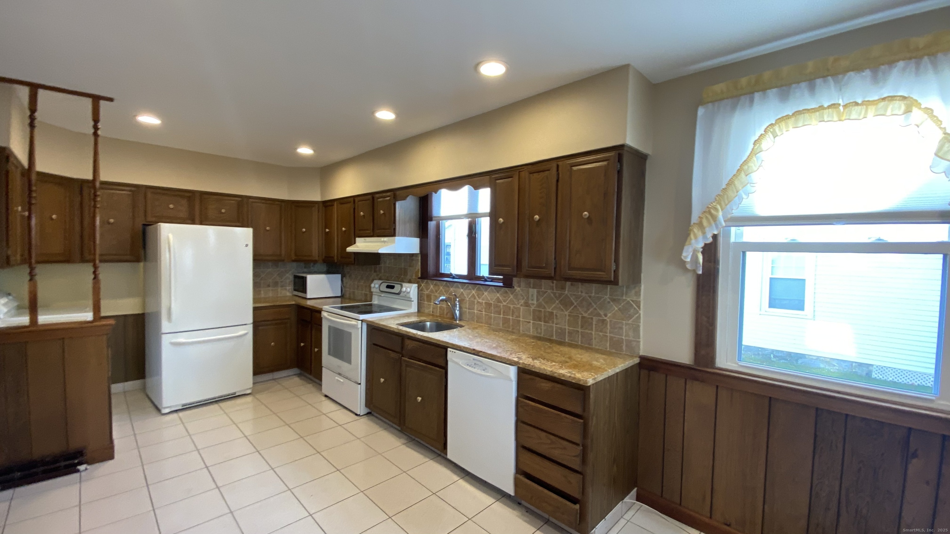135 Elm Street, Unit 1 Winsted, CT 06098 - Photo 7 of 32 a kitchen with a refrigerator sink and stove
