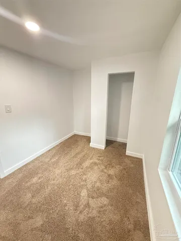 an empty room with a fireplace