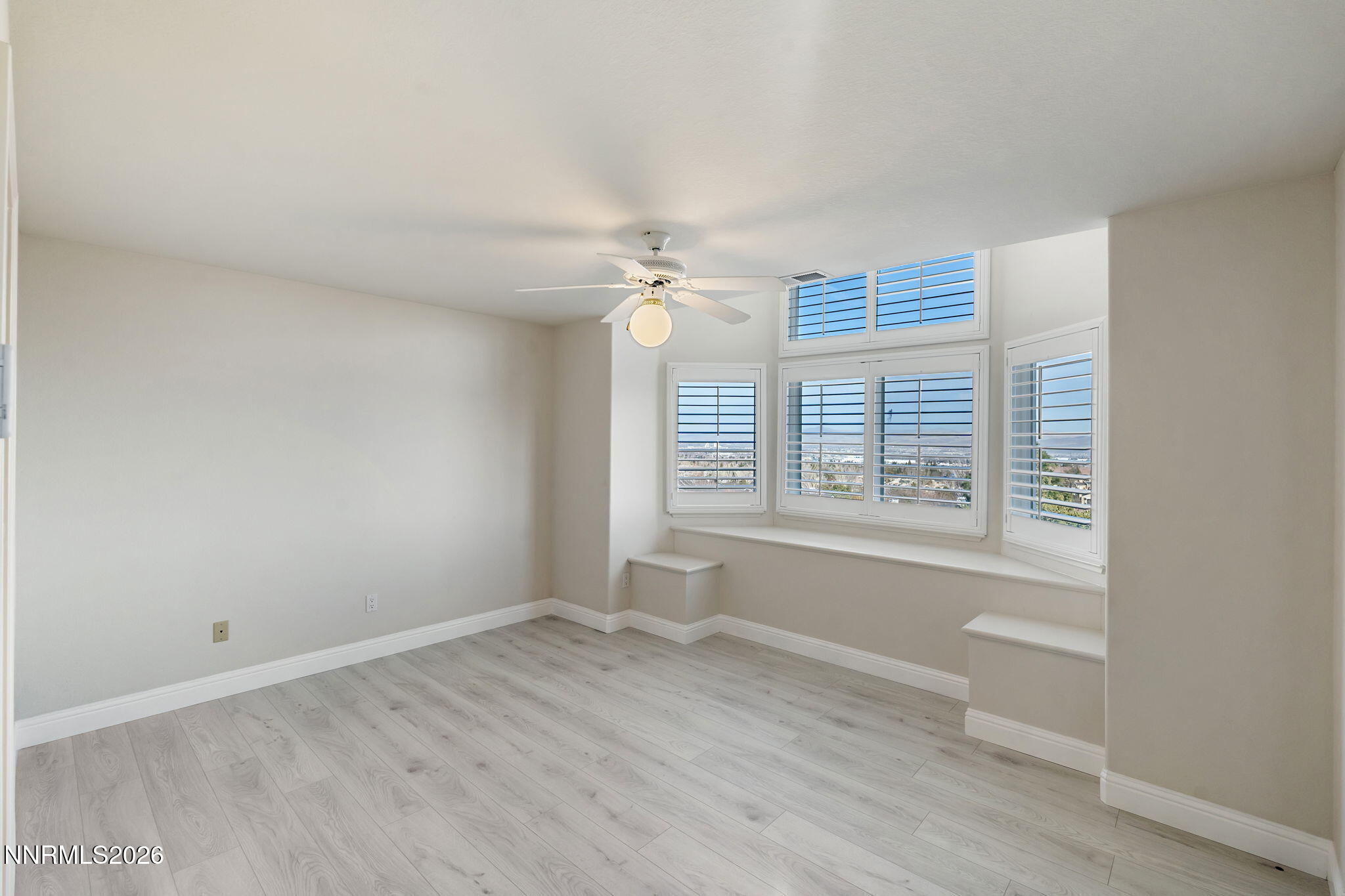 6186 Squires Lane Reno, NV 89519 - Photo 30 of 57 a view of a room with wooden floor and a window