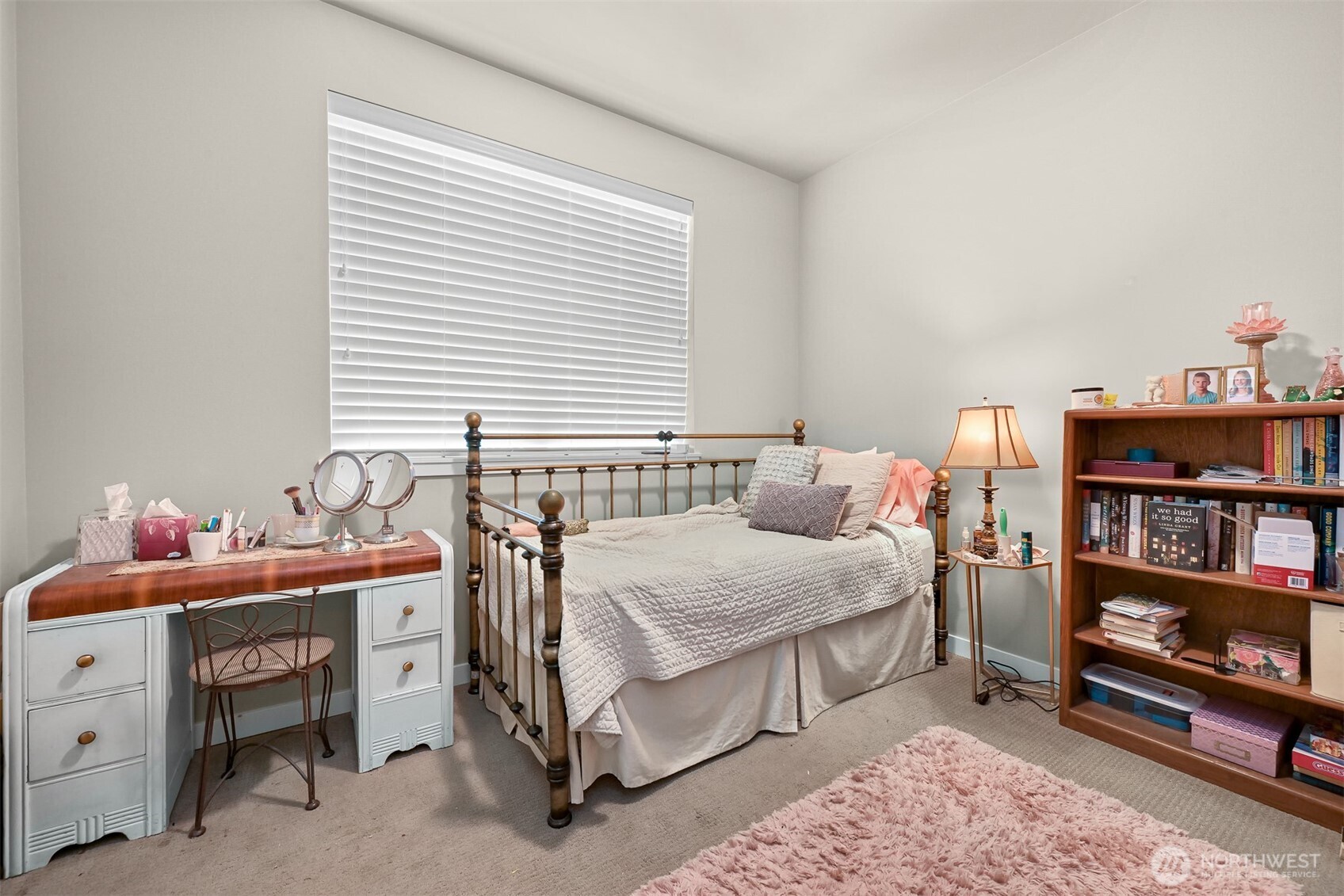 8844 Depot Road, Unit B101 Lynden, WA 98264 - Photo 14 of 30 a bedroom with a bed and a bookshelf