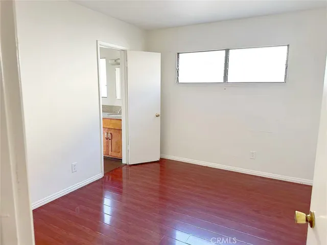 an empty room with wooden floor