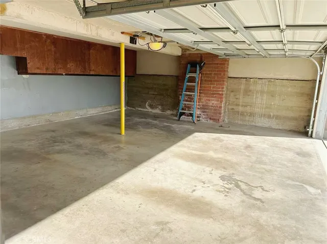 a table and chairs sitting in front of a house