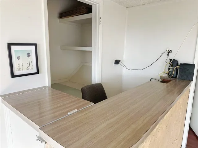 a bedroom with a bed and a large mirror