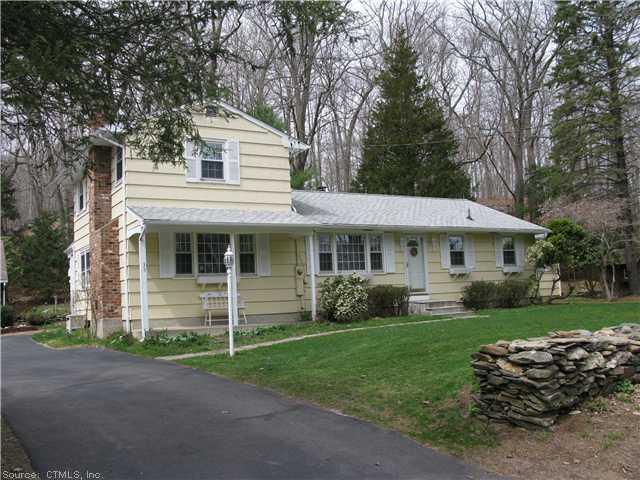 33 Goose Hill Road Chester, CT 06412 - Photo 1 of 1 a front view of a house with a garden and yard