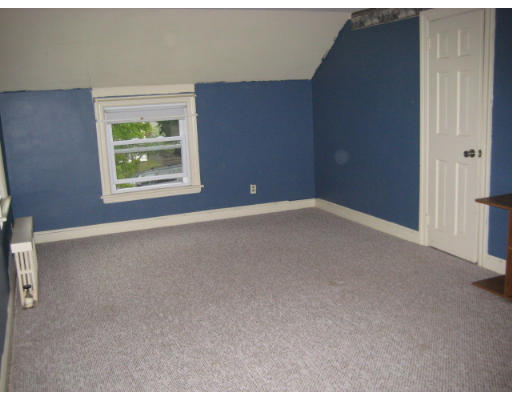 194 Dayton Street Springfield, MA 01118 - Photo 11 of 20 a view of an empty room with windows