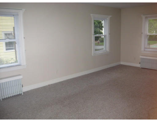 194 Dayton Street Springfield, MA 01118 - Photo 3 of 20 an empty room with windows