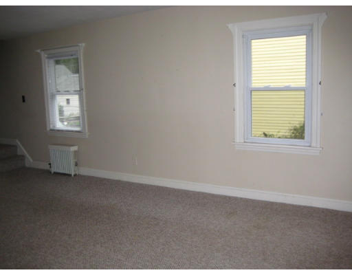 194 Dayton Street Springfield, MA 01118 - Photo 4 of 20 an empty room with windows