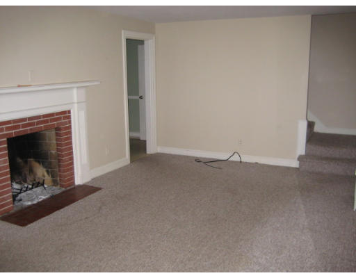 194 Dayton Street Springfield, MA 01118 - Photo 5 of 20 a view of empty room with a fireplace