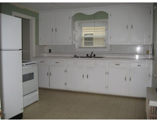 194 Dayton Street Springfield, MA 01118 - Photo 8 of 20 a kitchen with granite countertop white cabinets white appliances and sink