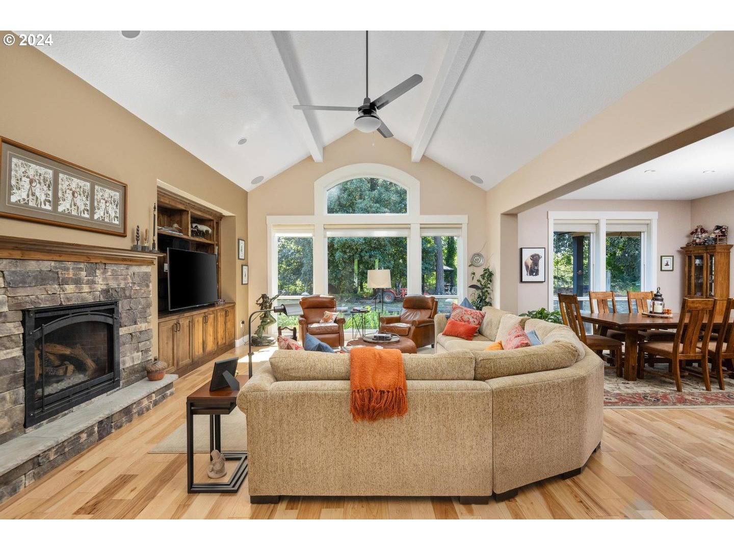 8225 Northeast Dog Ridge Road Newberg, OR 97132 - Photo 6 of 48 a living room with furniture a large window and a fireplace