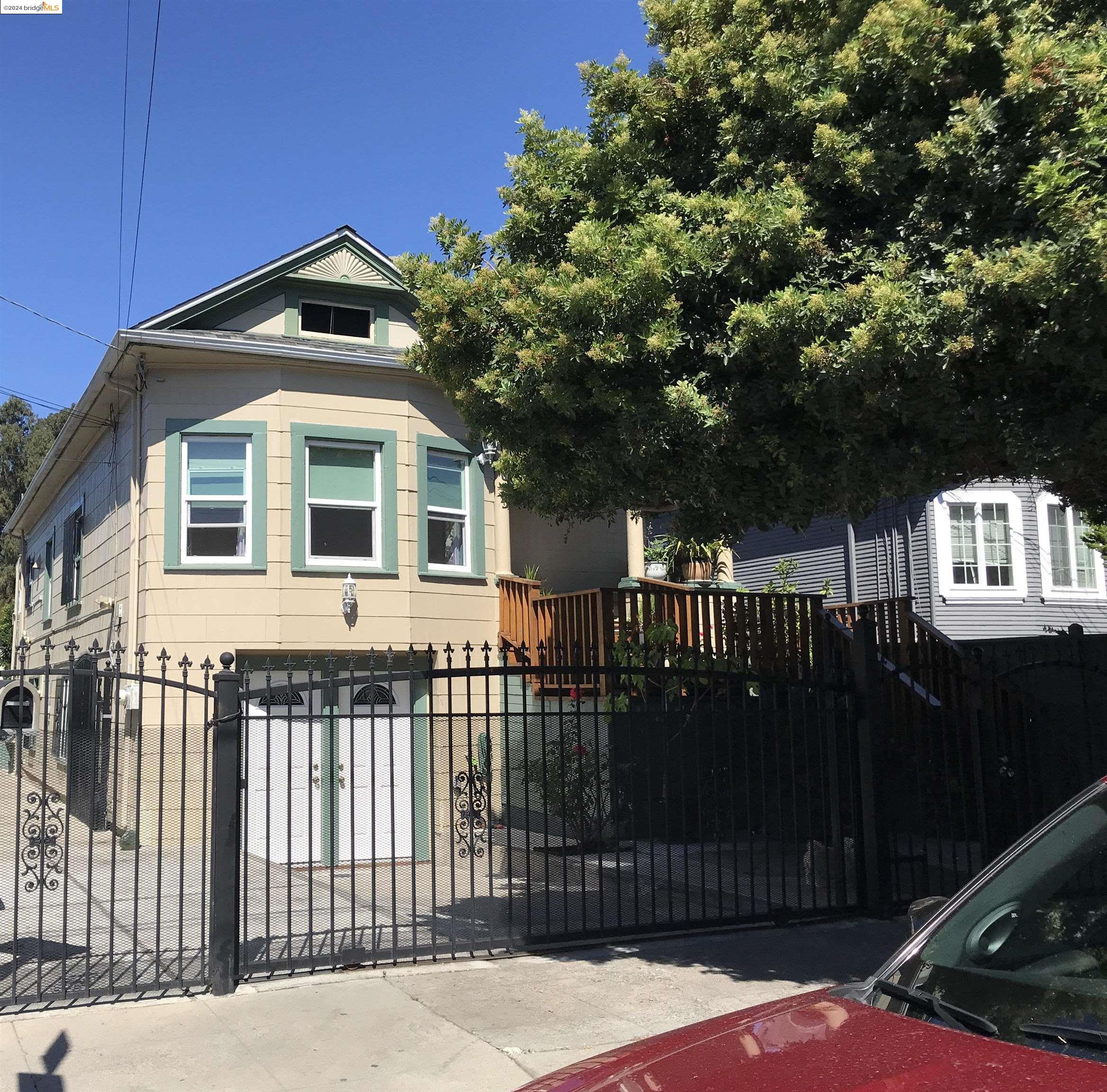 2035 Rutherford Street Oakland, CA 94601 - Photo 1 of 1 a front view of a house with a garden