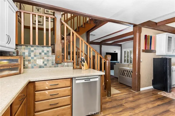 a kitchen with a refrigerator and a sink