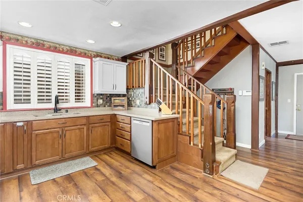 a kitchen with sink cabinets and outdoor space