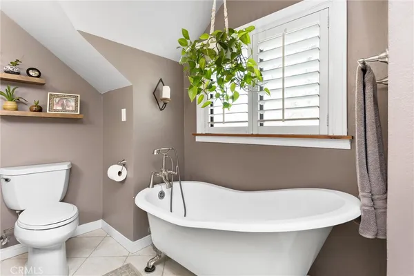 a bathroom with a toilet a sink and a bathtub