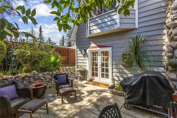 a view of a chairs and table in the patio