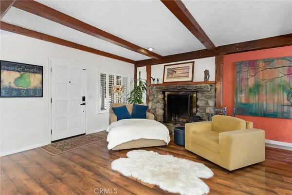 a bedroom with furniture and a fireplace